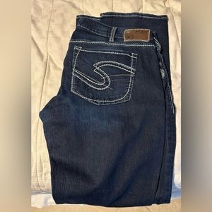 Dark wash jeans.